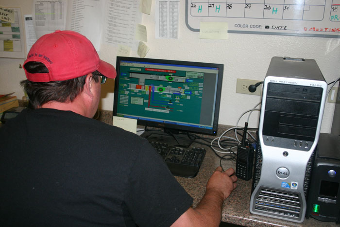 man working with computerized energy management system
